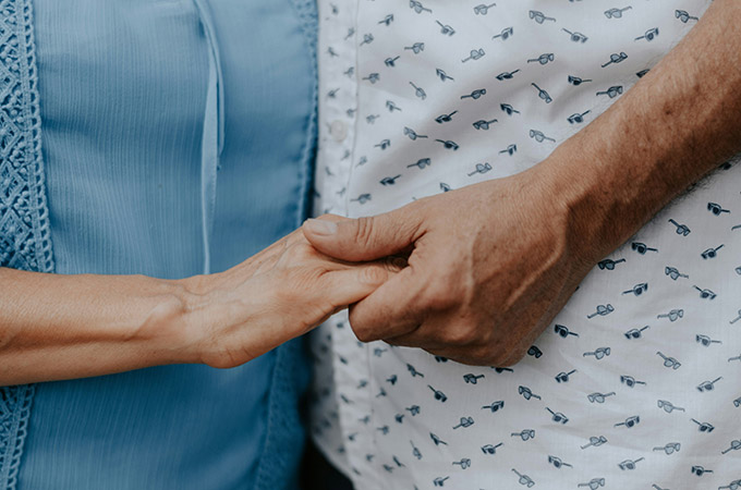 Couple holding hands